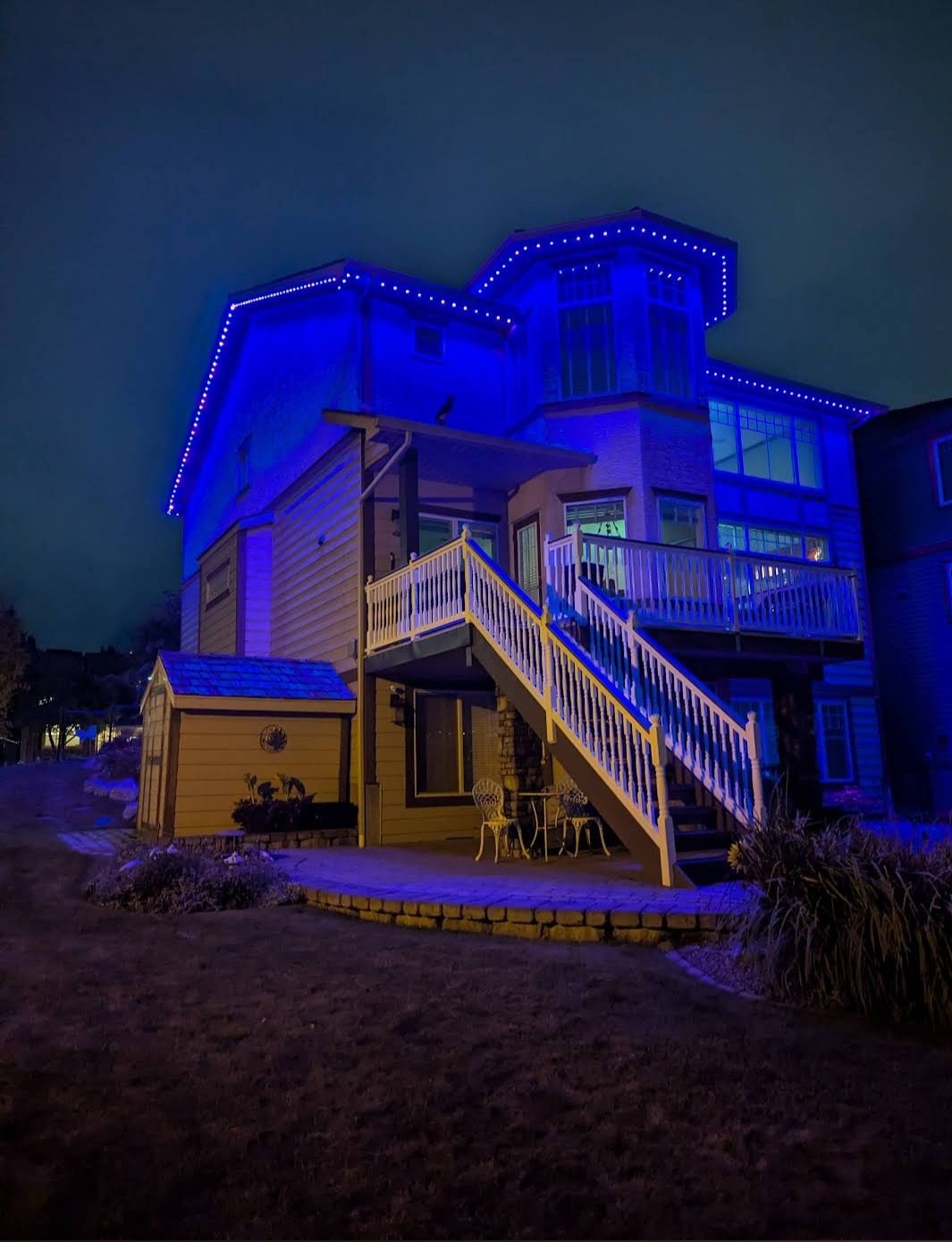 Winnipeg home with blue and purple permanent outdoor LED lighting
